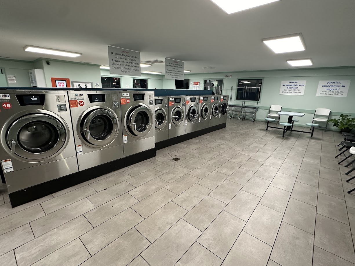 Row of large-capacity Speed Queen washers inside The Bubble Hut Coin Laundry in Athens, Alabama