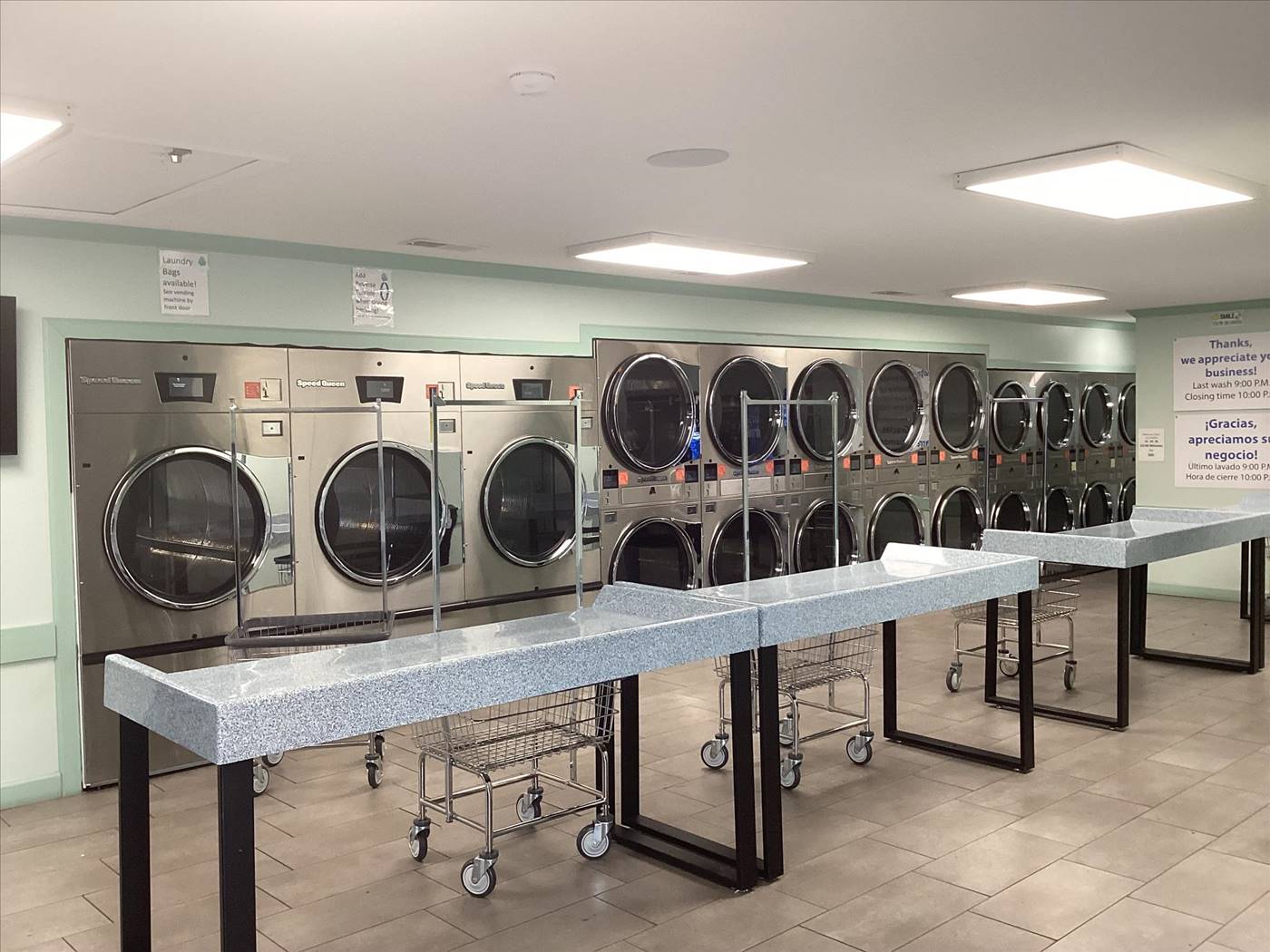 Speed Queen dryers and folding tables at The Bubble Hut Coin Laundry on Highway 31 in Athens, AL